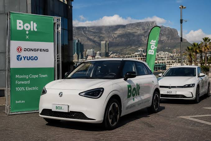 Bolt electric vehicles at the earlier Cape Town rollout with Table Mountain in the background